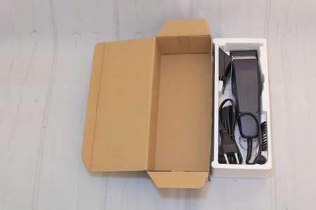 Closeup shot of a hair clipper in the packing box on the white background