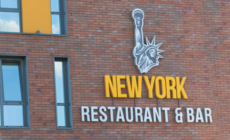 Chisinau, Moldova - August 2, 2022 The Statue of Liberty attached to a brick building and a text like New yourk Restaurant Bar.の写真素材