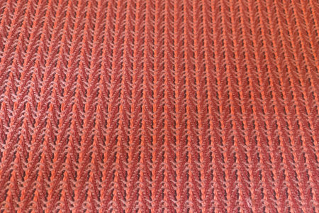 Red knitted fabric as an abstract background. Close-up.の写真素材