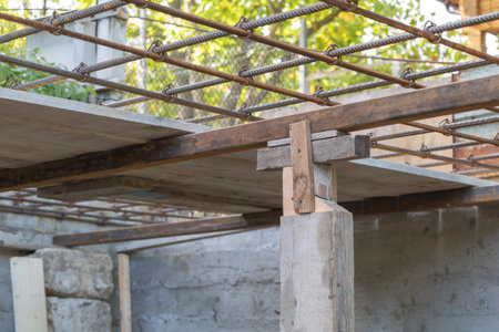 Construction site with scaffolding and steel structure, closeup of photo.
