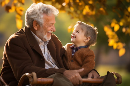 Portrait of a happy grandfather and his grandson in the autumn park. Ai Generated.の素材