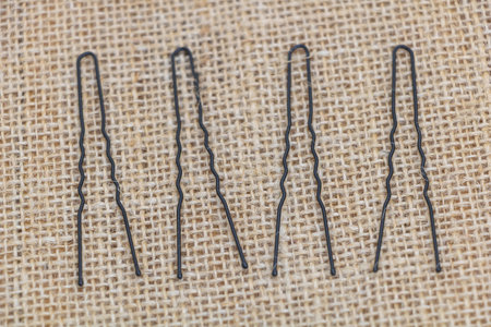 A set of hair pins, with a straight line shape, made of steel material, in black color.の写真素材
