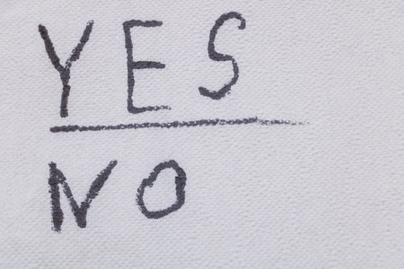 Yes and No concept, written with a marker on white paper.の写真素材