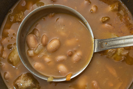 Close-up of Bean Soup with Ladle in Potの写真素材