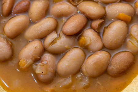 Close-up of Cooked Beans in Broth, Delicious and Savory Meal.の写真素材