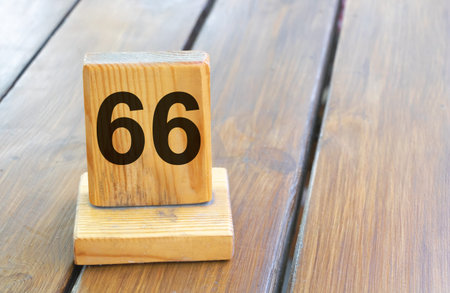 Wooden number 66 on a plank tabの写真素材