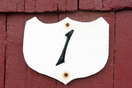 Handmade, vintage ROOM NUMBER 1 sign for room at sketchy motel.の写真素材