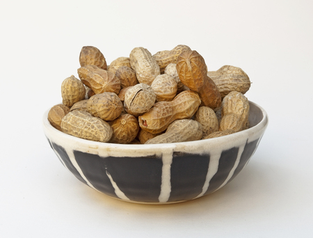 Bowl filled with chubby peanuts.