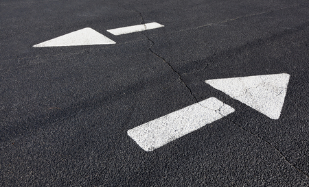 Street direction arrows pointing in opposite directions.