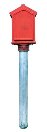 Isolated vintage red fire alarm box on metal pole. Isolated.の写真素材