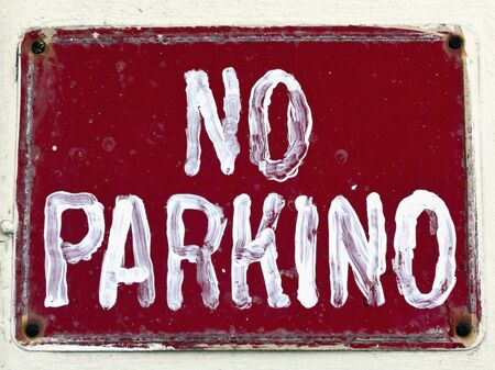 Homemade NO PARKING (PARKINO) sign. No Parking misspelling sign. Isolated.の写真素材
