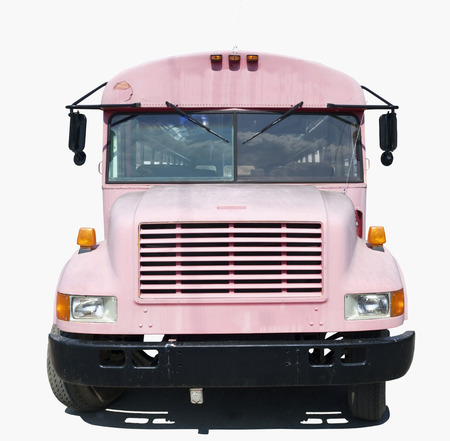 Isolated front view of old faded school bus painted pink.