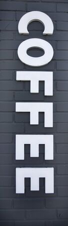 Simple COFFEE sign. Isolated. Vertical.の写真素材