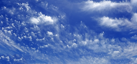 Blue sky cloudscape background. Horizontal.