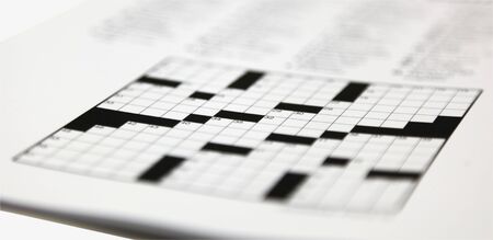 Shallow focus on daily newspaper crossword puzzle.の写真素材