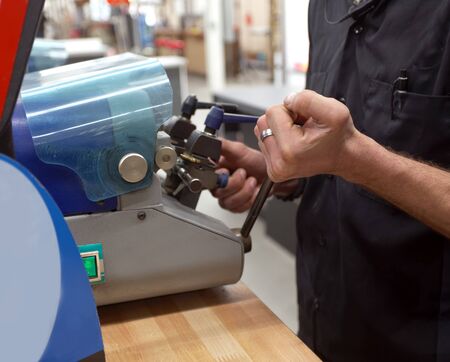 Key maker copying key at machine.の写真素材