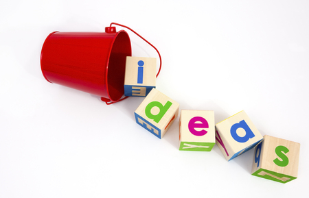 Ideas concept spilling from a red pail.の写真素材