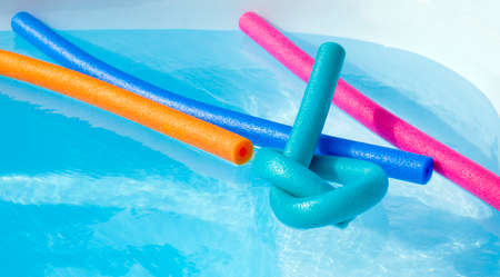 Colorful plastic noodle in a swimming pool. Nobody.の写真素材