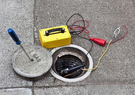 Natural gas inspection and maintenance tools on sidewalk.の写真素材