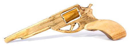 Handmade carved wood toy gun. Isolated.の写真素材