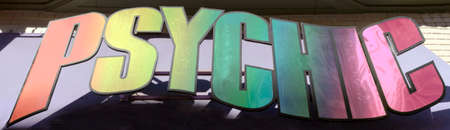 Colorful PSYCHIC sign mounted on building.の写真素材