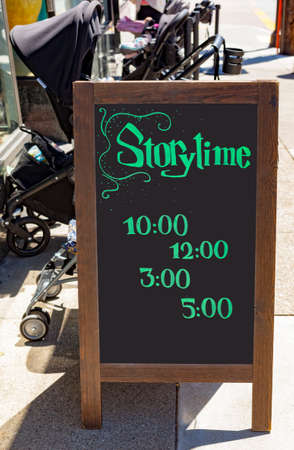 Childrens STORY TIME sign with reading hours.