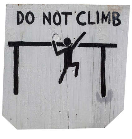 Cautionary handmade DO NOT CLIMB sign on weathered white plywood. Isolated on white.