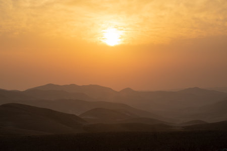 mountain silhouette in the desert at sunset sunriseの写真素材