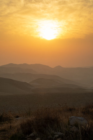 mountain silhouette in the desert at sunset sunriseの写真素材
