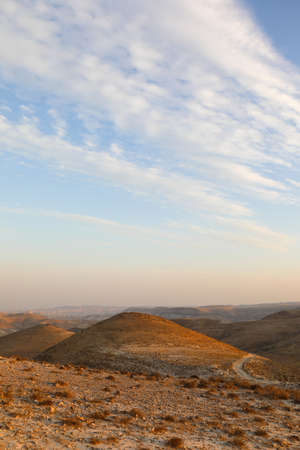 Mountain landscape against the backdrop of a fiery red sunsetの写真素材