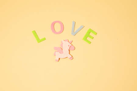 Valentines day concept with letters love and wooden heart. Decor in shape of word LOVE. white letters. Valentine concept. Color of the year 2022. Very peri tint. Selective focus.の写真素材