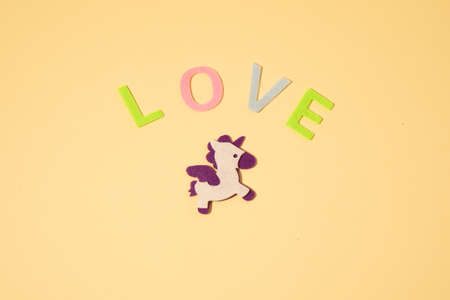 Valentines day concept with letters love and wooden heart. Decor in shape of word LOVE. white letters. Valentine concept. Color of the year 2022. Very peri tint. Selective focus.の写真素材