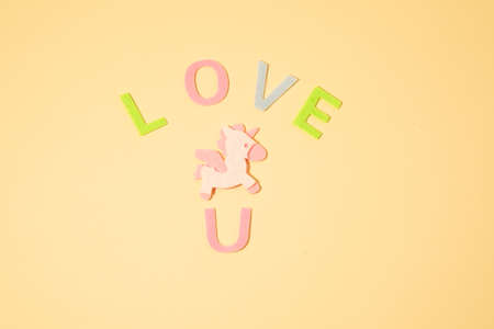 Valentines day concept with letters love and wooden heart. Decor in shape of word LOVE. white letters. Valentine concept. Color of the year 2022. Very peri tint. Selective focus.の写真素材