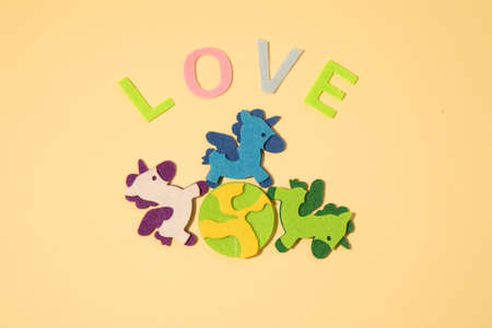Valentines day concept with letters love and wooden heart. Decor in shape of word LOVE. white letters. Valentine concept. Color of the year 2022. Very peri tint. Selective focus.の写真素材