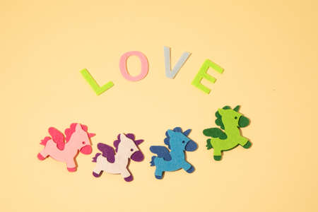 Valentines day concept with letters love and wooden heart. Decor in shape of word LOVE. white letters. Valentine concept. Color of the year 2022. Very peri tint. Selective focus.の写真素材