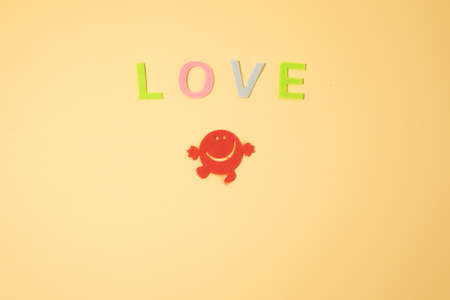 Valentines day concept with letters love and wooden heart. Decor in shape of word LOVE. white letters. Valentine concept. Color of the year 2022. Very peri tint. Selective focus.の写真素材