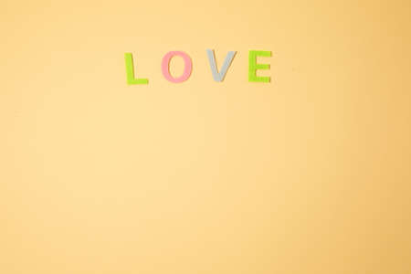 Valentines day concept with letters love and wooden heart. Decor in shape of word LOVE. white letters. Valentine concept. Color of the year 2022. Very peri tint. Selective focus.の写真素材