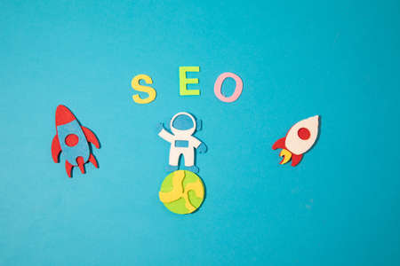 Valentines day concept with letters love and wooden heart. Decor in shape of word LOVE. white letters. Valentine concept. Color of the year 2022. Very peri tint. Selective focus.の写真素材