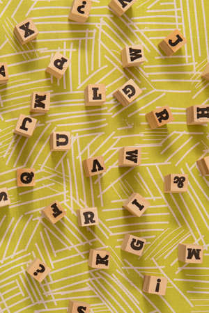 words written on wood block green backgroud