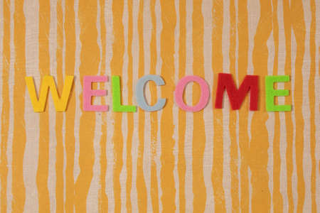 dising blackboard with the color words welcomeの写真素材