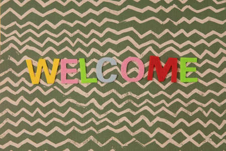dising blackboard with the color words welcomeの写真素材