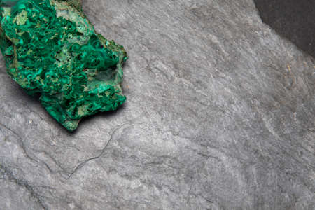 Dark grey slate stone or black stone wall texture backgroundの写真素材