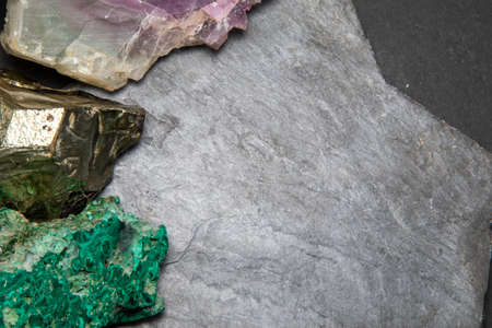 Dark grey slate stone or black stone wall texture backgroundの写真素材