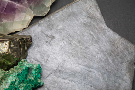 Dark grey slate stone or black stone wall texture backgroundの写真素材