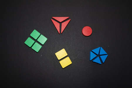 Childrens wooden toy. The child collects a sorter. Educational logic toys for kids.