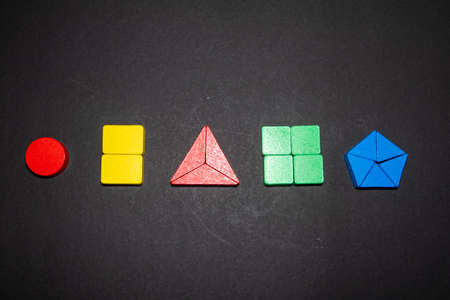 Childrens wooden toy. The child collects a sorter. Educational logic toys for kids.
