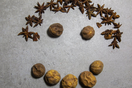 Dry anise stars on wooden table. Anise stars close up background. High quality photo