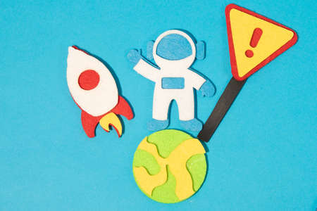 The launch into space. Flying rocket through the clouds. Start up of the space rocket. Rocket ship in flat design on blue background. 3d paper . Concept of business launch. Paper cut.の写真素材