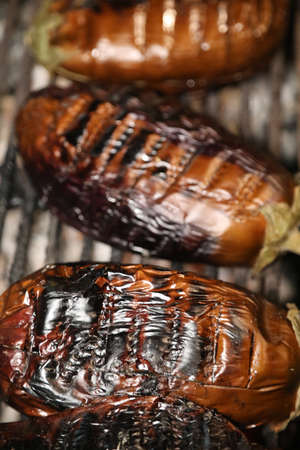 Eggplant on a grilling pan on a black background, top view. Flat lay, overhead, from above. Copy space.の写真素材