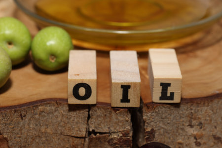 Olives and Olive Oil on wooden backgroundの写真素材